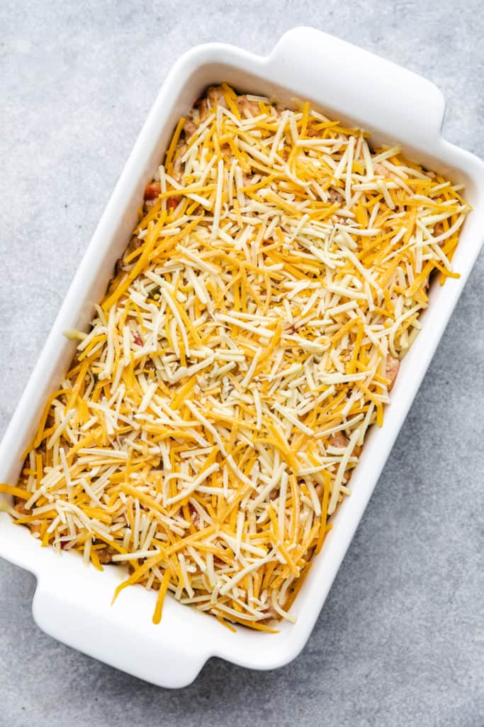 Cheese sprinkled over casserole filling.