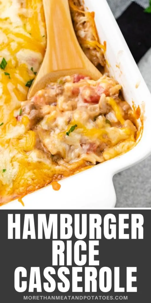 Close up view of cheesy hamburger rice casserole in a white dish.