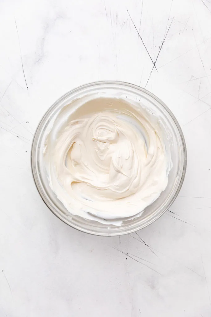 White candy melts melted in a bowl.