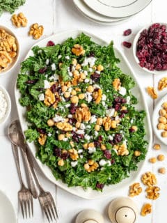 Kale salad topped with chickpeas, cranberries, and feta.