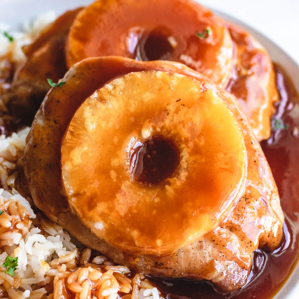 Close up view of brown sugar and pineapple pork chops.