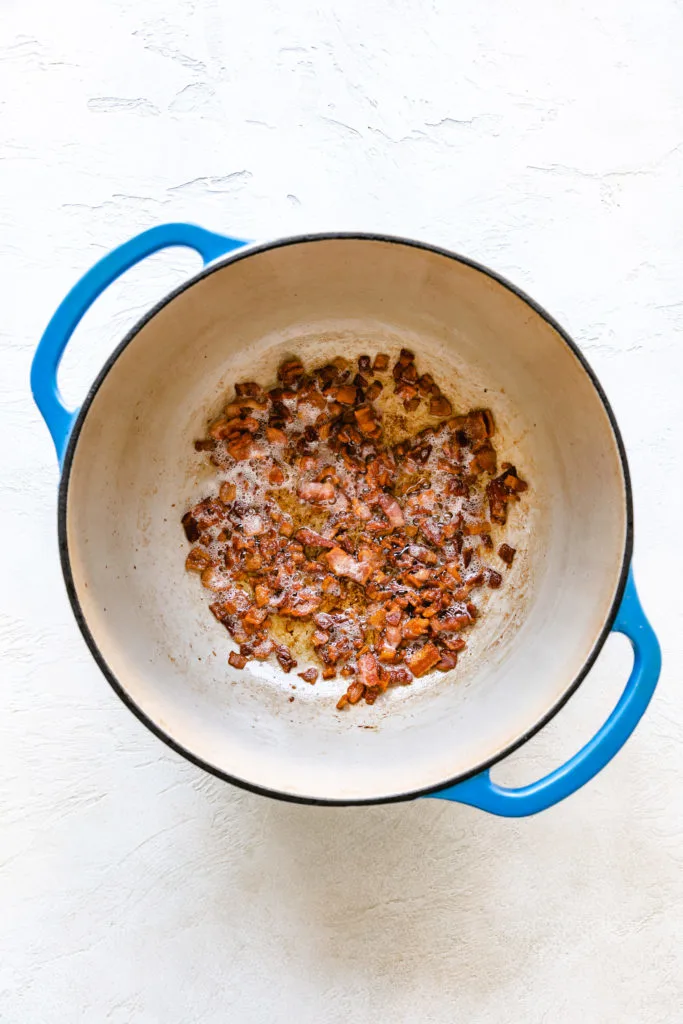 Bacon cooking in a pan.