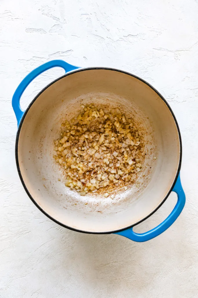 Onions cooking in a pan.