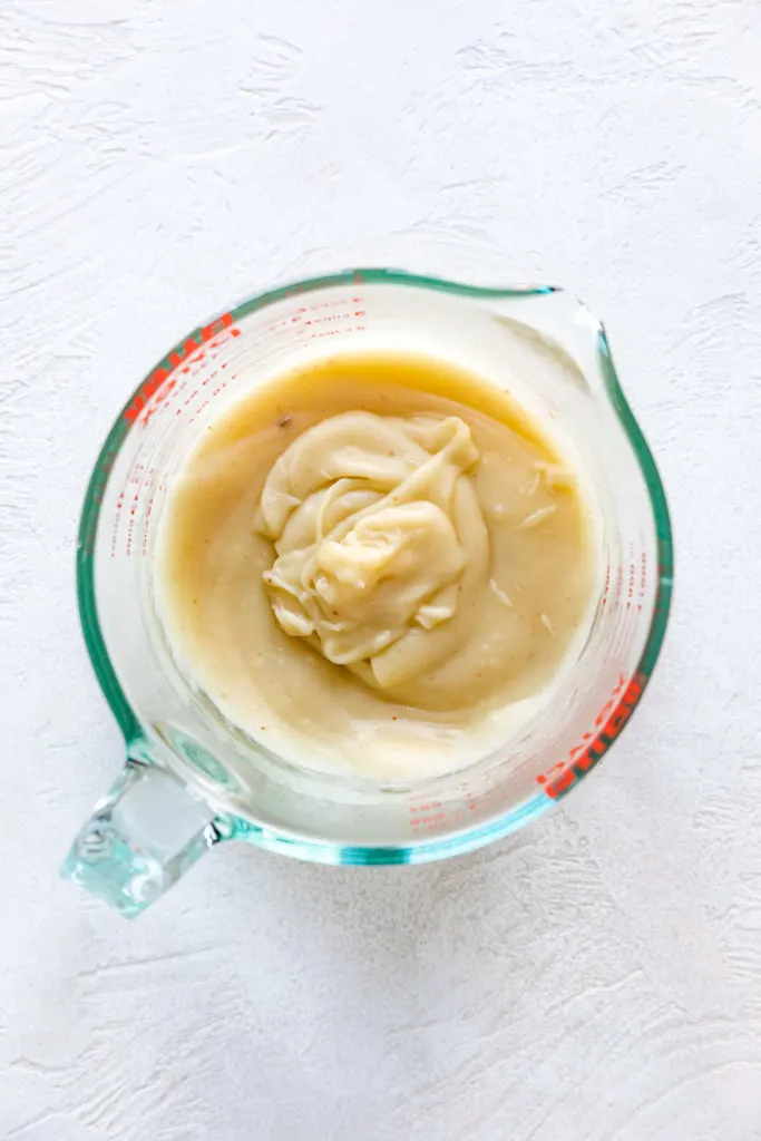 Pureed potatoes in a measuring cup.