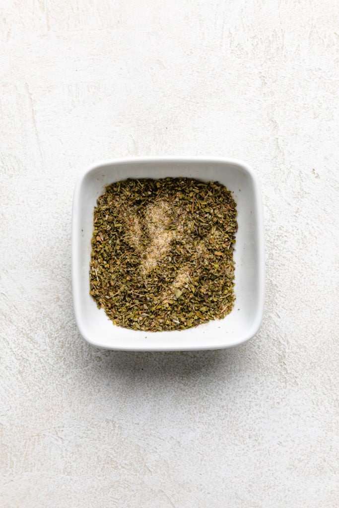 Savory seasonings stirred together in a bowl.