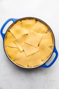 Cheese slices on top of casserole filling.