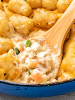 Close up view of chicken tater tot casserole in a pan.