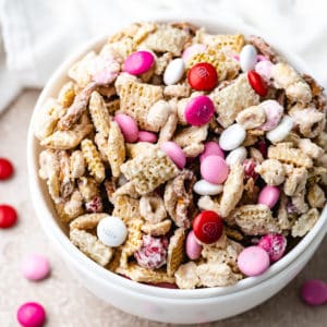 Close up view of a bowl of Valentine's Chex Mix.