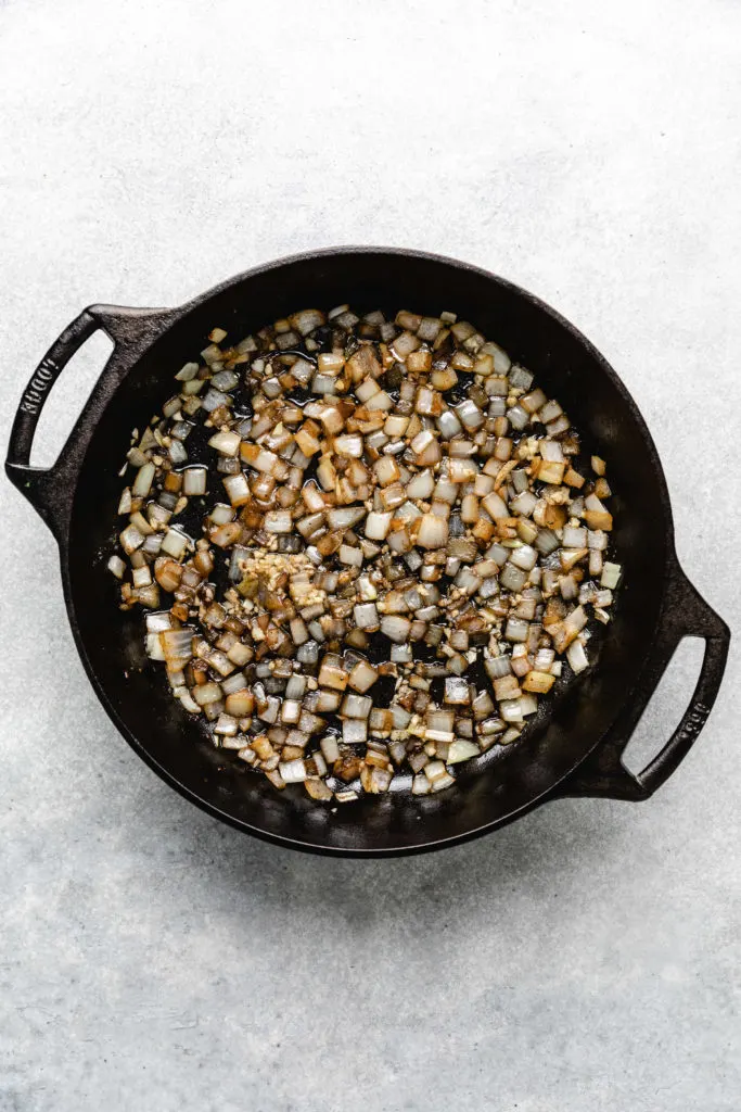 Sauteed onions and garlic in a pan.