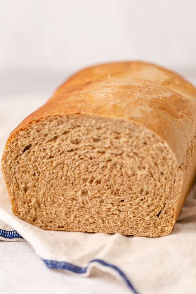 Close up view of a loaf of wheat bread.