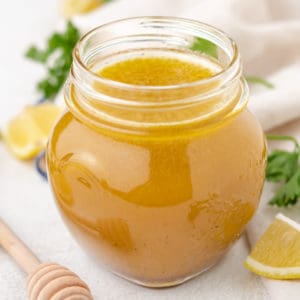 Close up view of a jar of salad dressing.