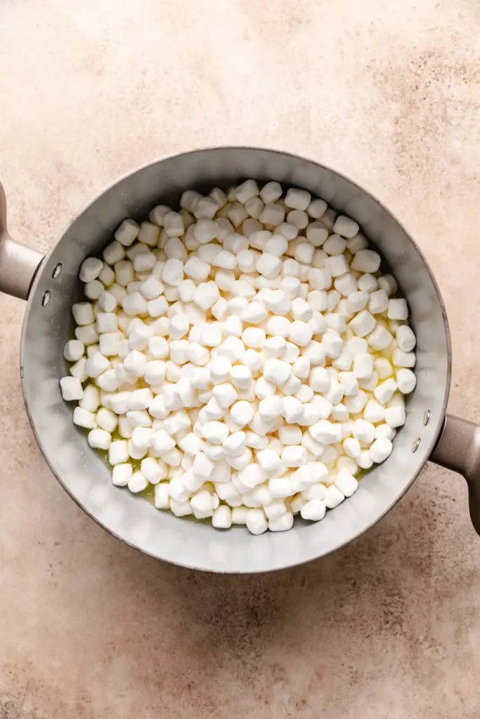 Mini marshmallows and melted butter in a pan.