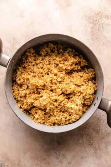 Rice krispies stirred into peanut butter and marshmallows.