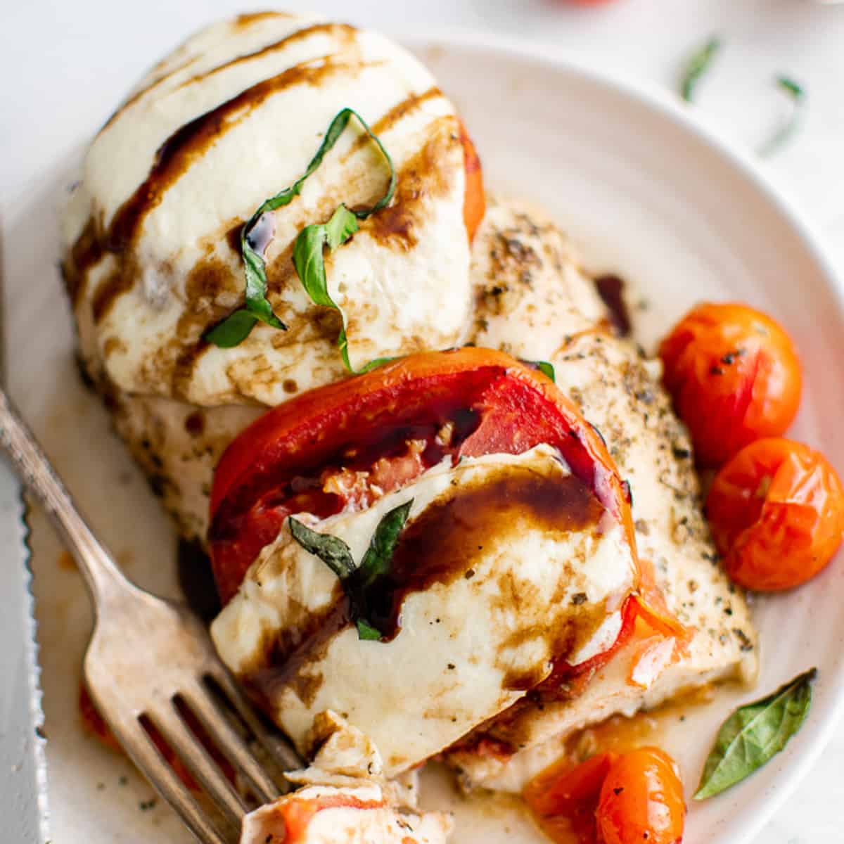 Chicken with mozzarella and tomatoes.
