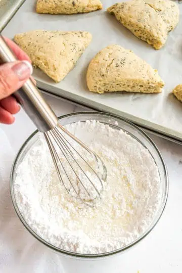 Top down view of powdered sugar and lemon juice.