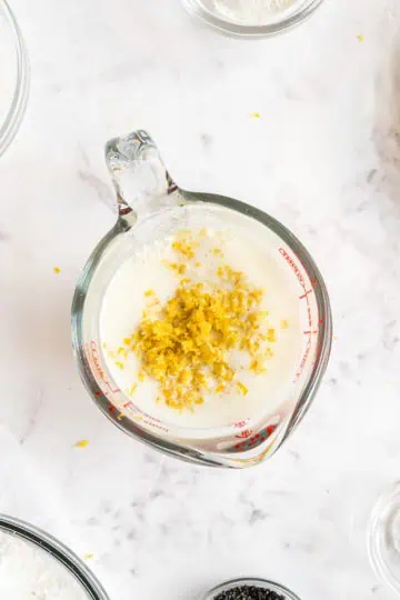 Buttermilk, lemon zest, and lemon juice in a measuring cup.