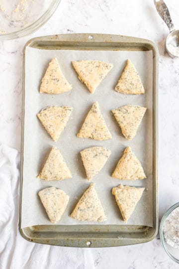 Unbaked scones on a sheet pan.