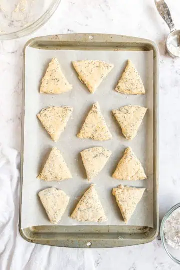 Unbaked scones on a sheet pan.