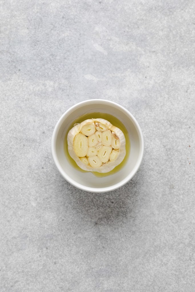 Garlic and olive oil in a bowl.