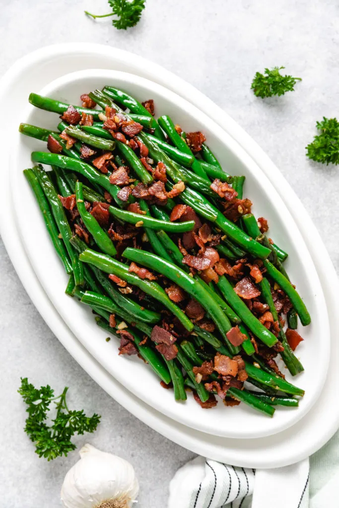 Top down view of veggies with garlic and bacon.