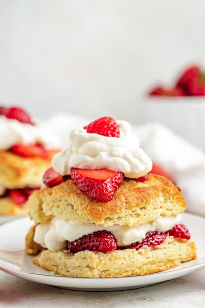 Close up view of strawberry shortcake on a plate.
