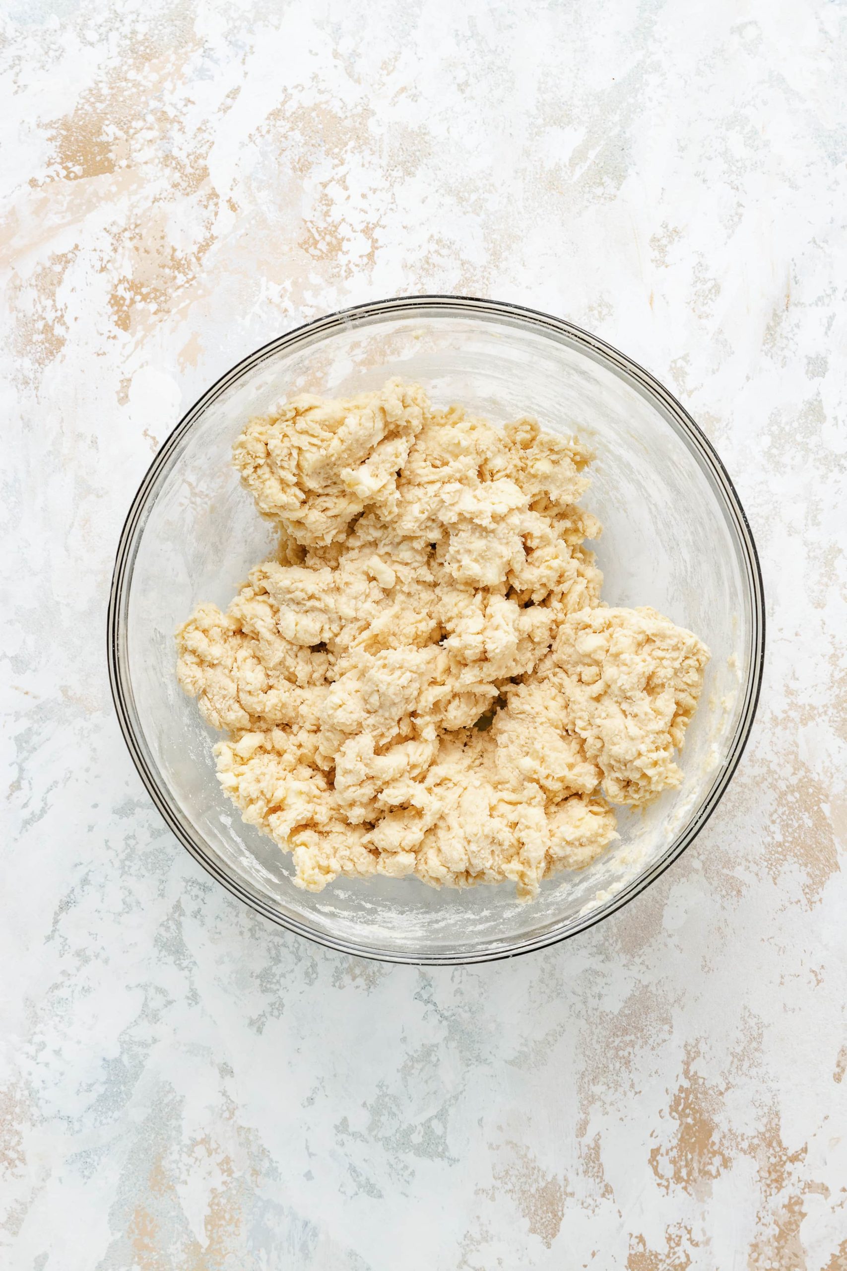 Buttermilk added to flour in a bowl.