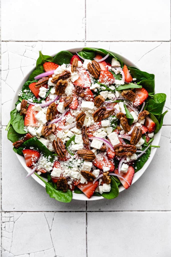 Candied pecans on top of a salad.