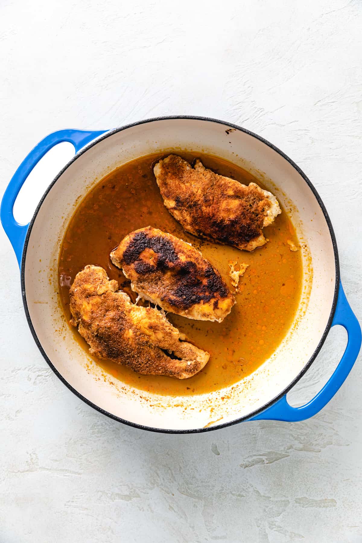 Baked chicken in a braiser pan.
