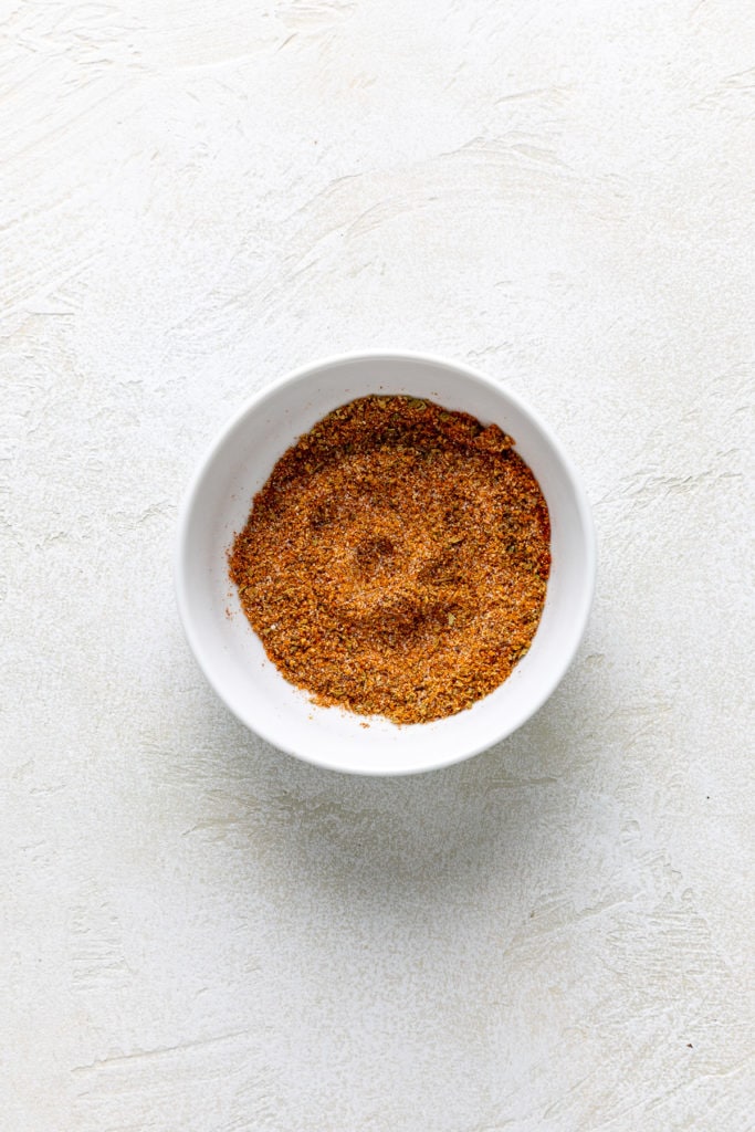 Fish seasoning in a white bowl.