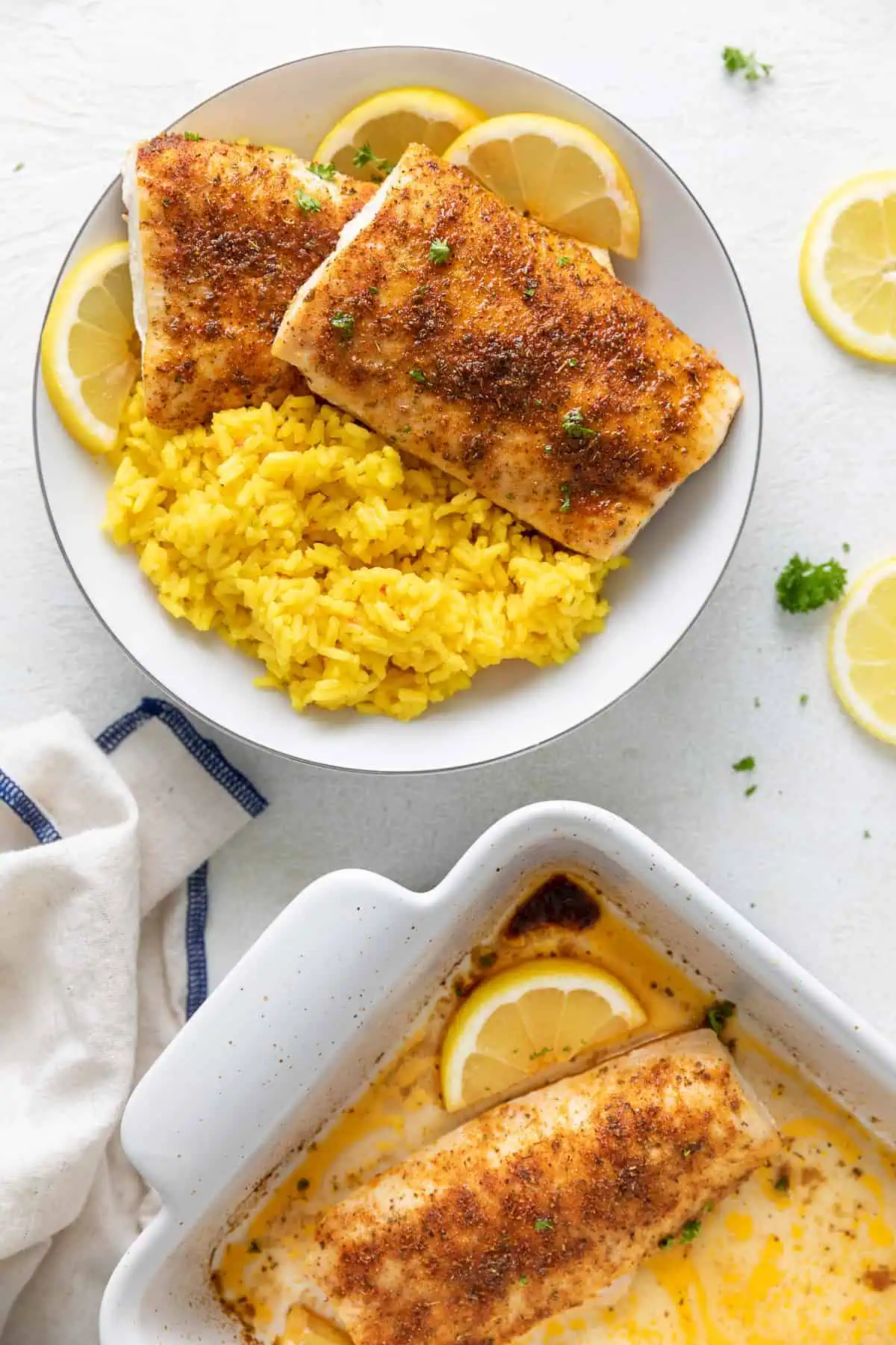 Top down view of fish filets and lemon slices.