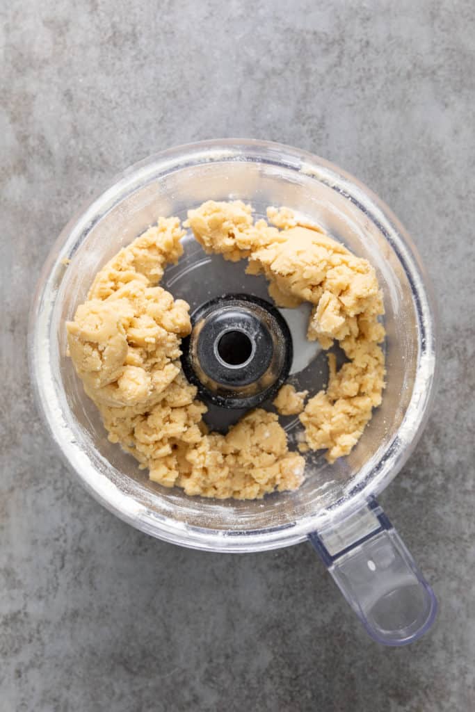 Unbaked crumble topping in a food processor.