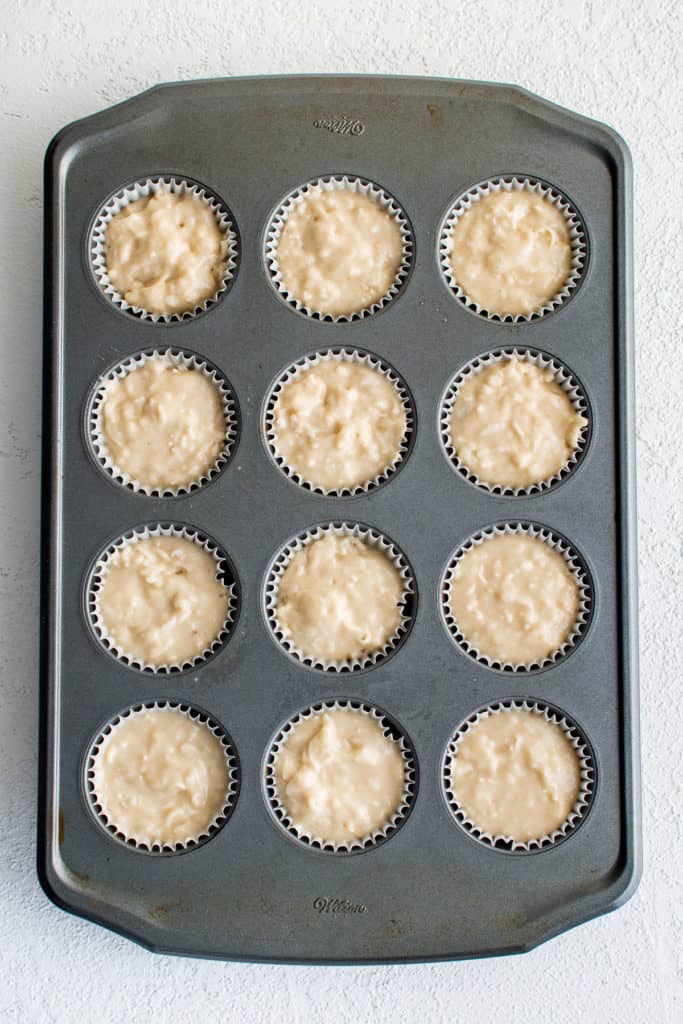 Coconut muffin batter in a pan.