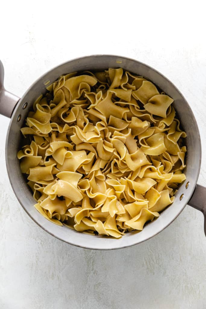 Pan of seasoned butter noodles.