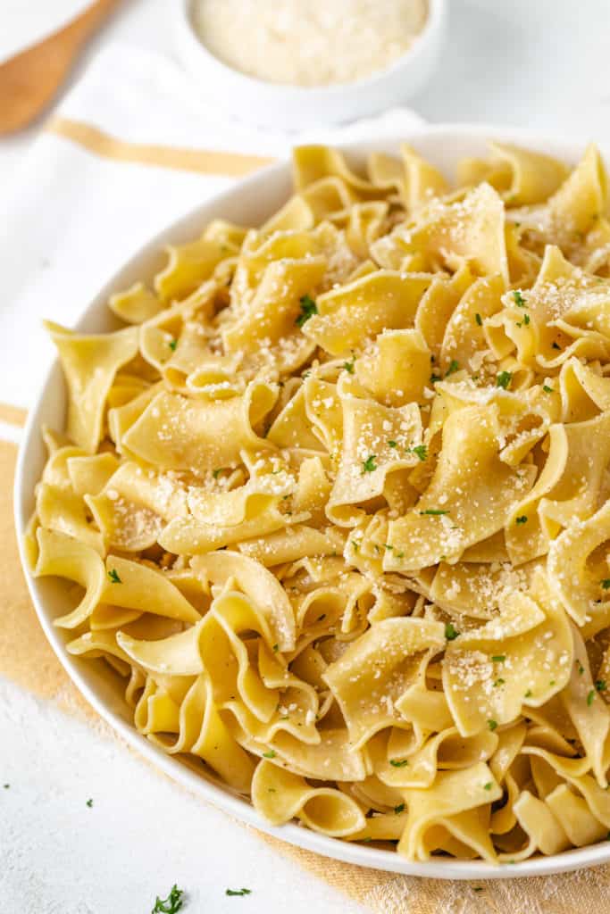 Butter and parmesan on top of egg noodles.