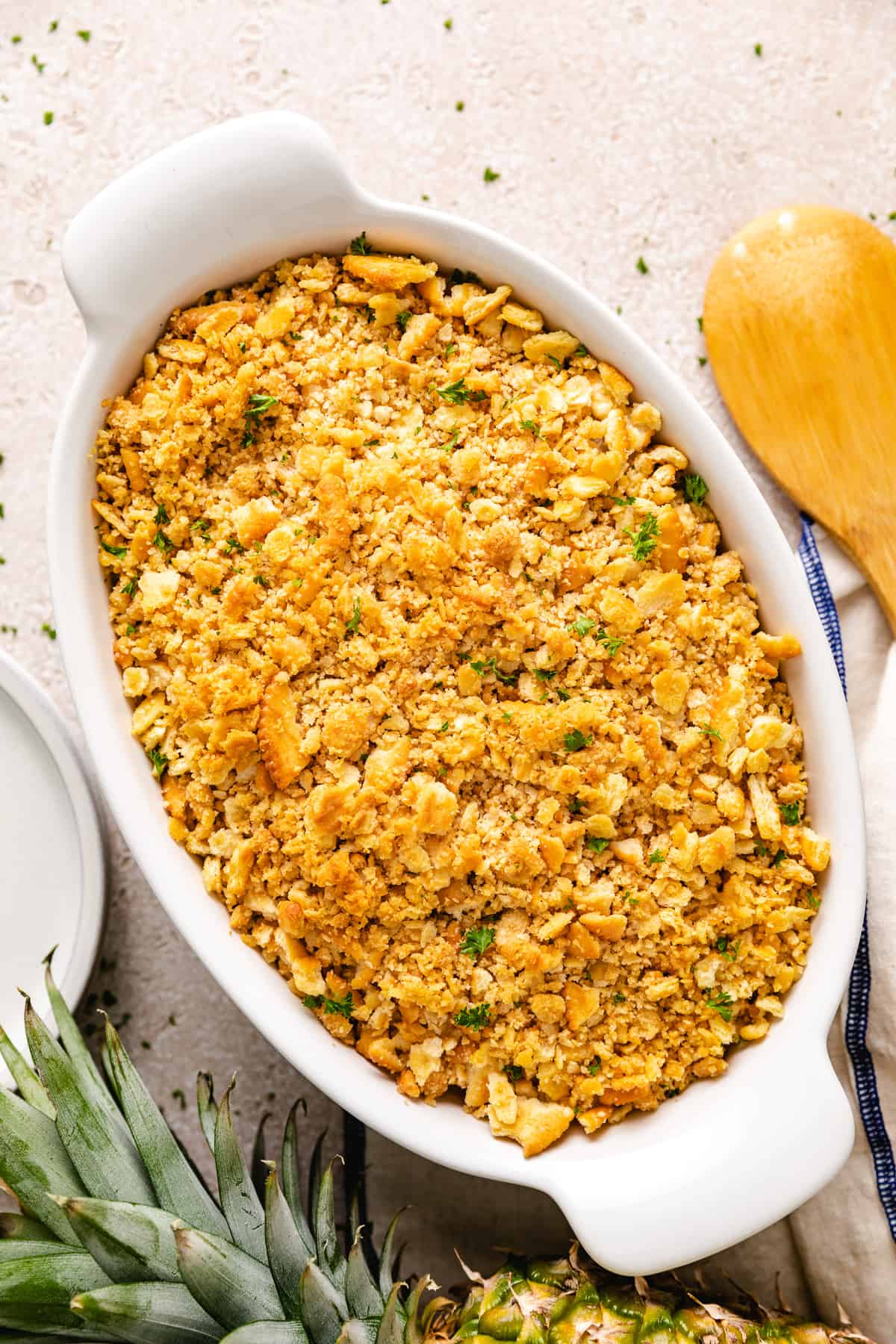 Top down view of a fruit casserole topped with crushed crackers.