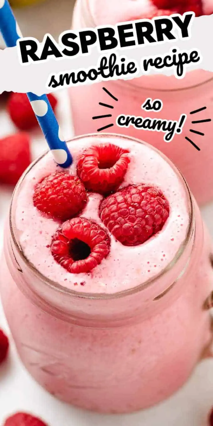 Close up view of raspberries on top of a fruit smoothie.