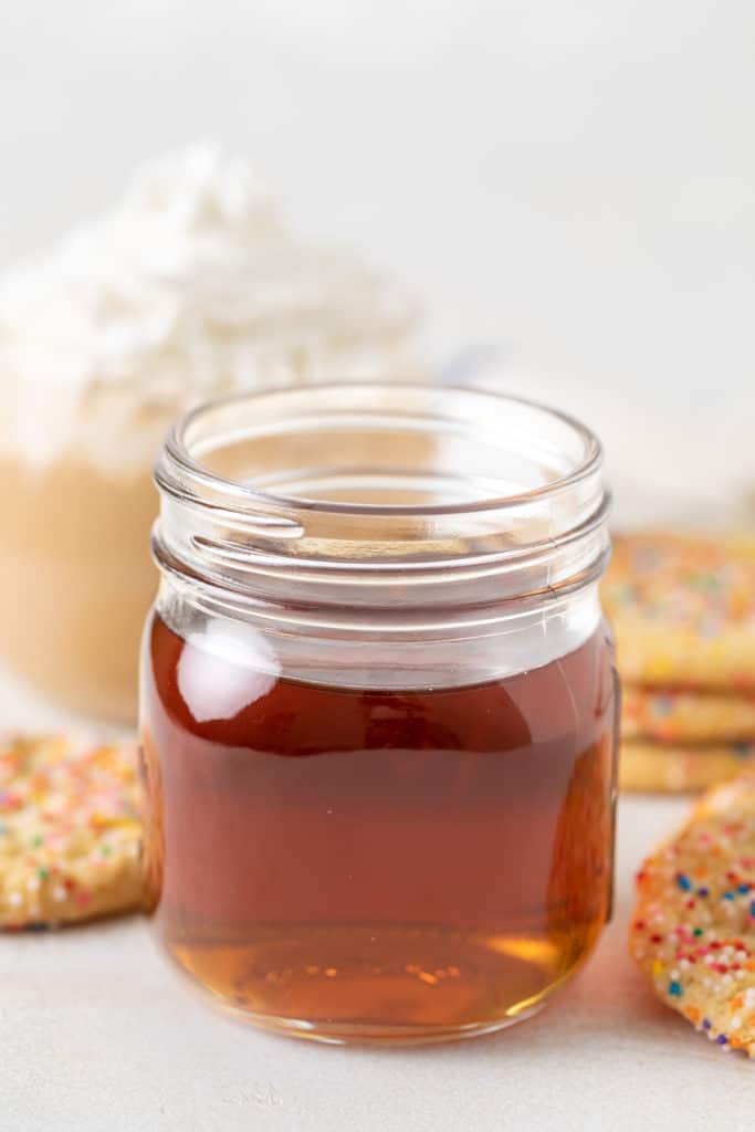 Side view of a jar of sugar cookie coffee syrup.