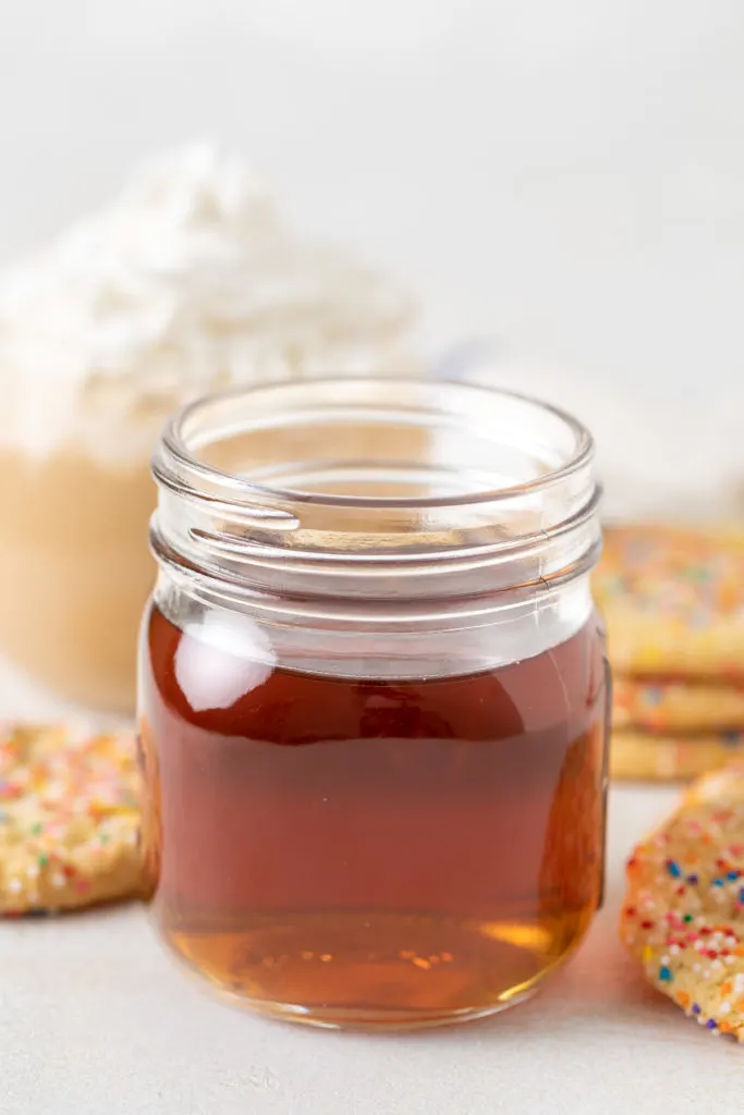 Side view of a jar of sugar cookie coffee syrup.