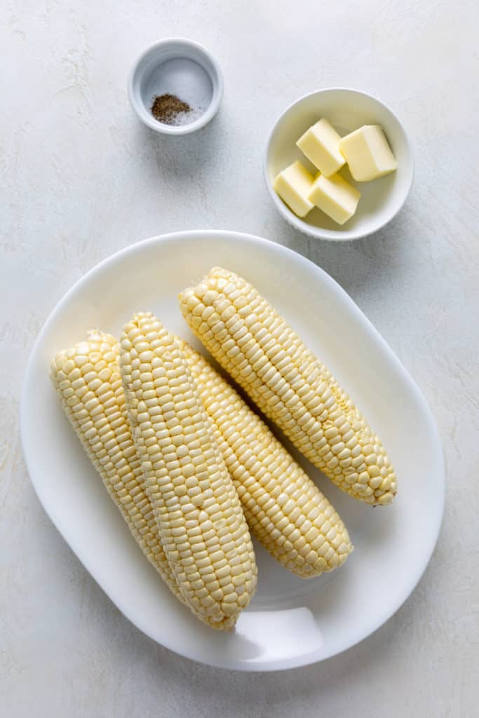 Ingredients needed for baked corn on the cob.
