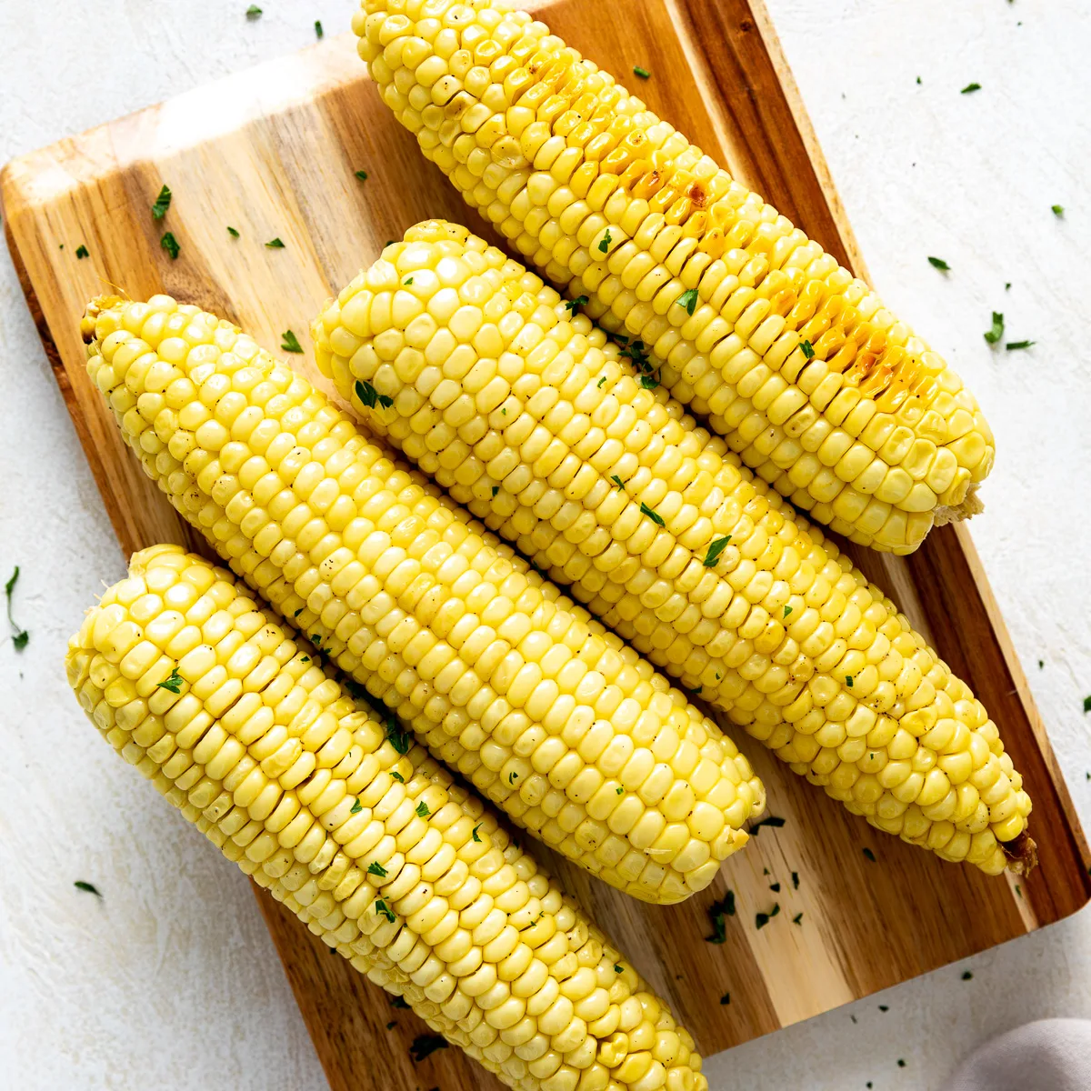 Close up view of freshly baked corn on the cob.