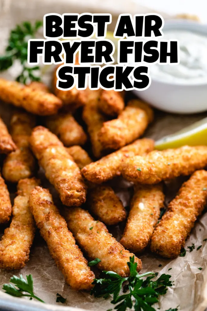 Close up view of fish sticks on parchment paper.