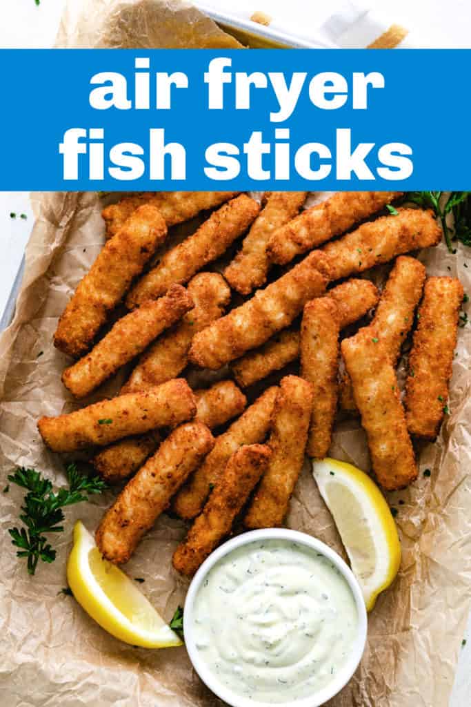 Top down view of fish sticks with lemon sauce.
