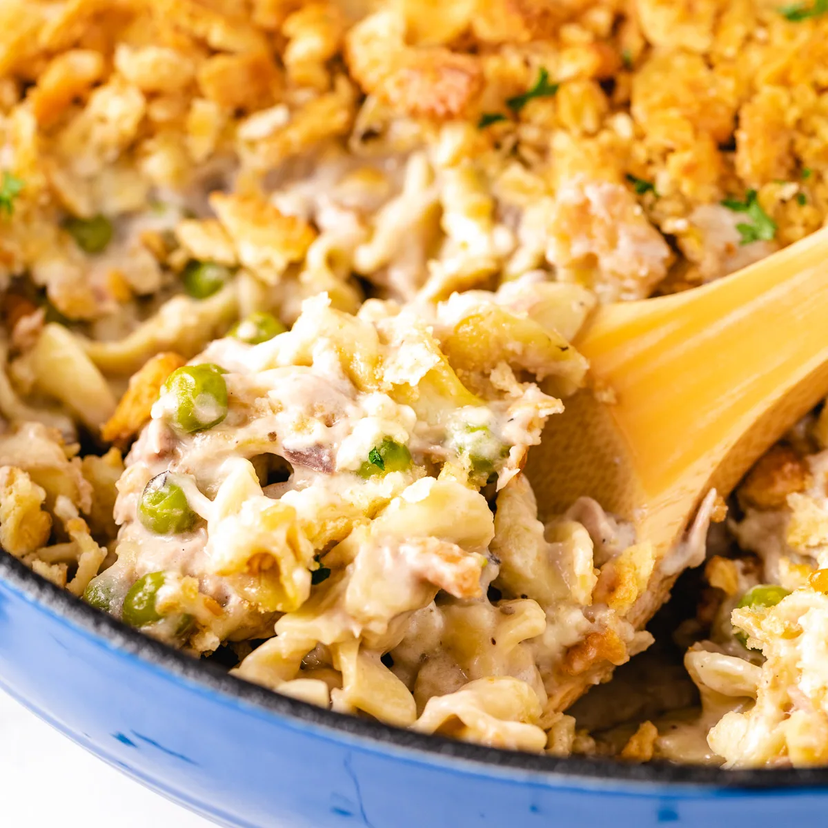 Tuna noodle casserole in a blue casserole dish.