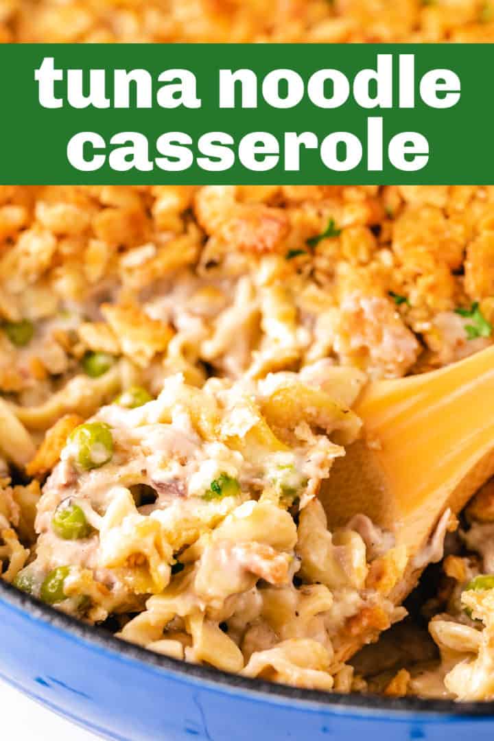 Brown spoon scooping casserole with noodles and tuna.