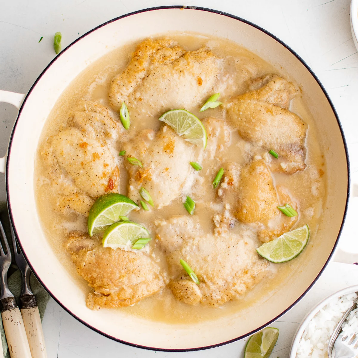 Close up view of a pan of coconut lime chicken.