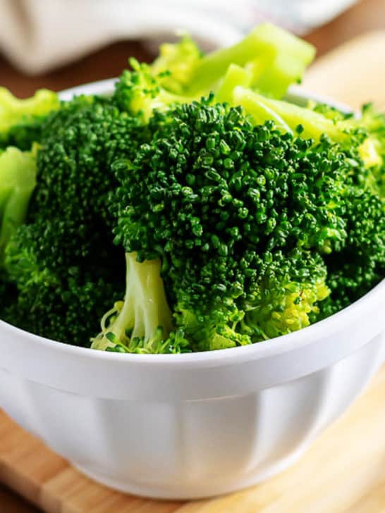 Close up view of a bowl of fresh broccoli.