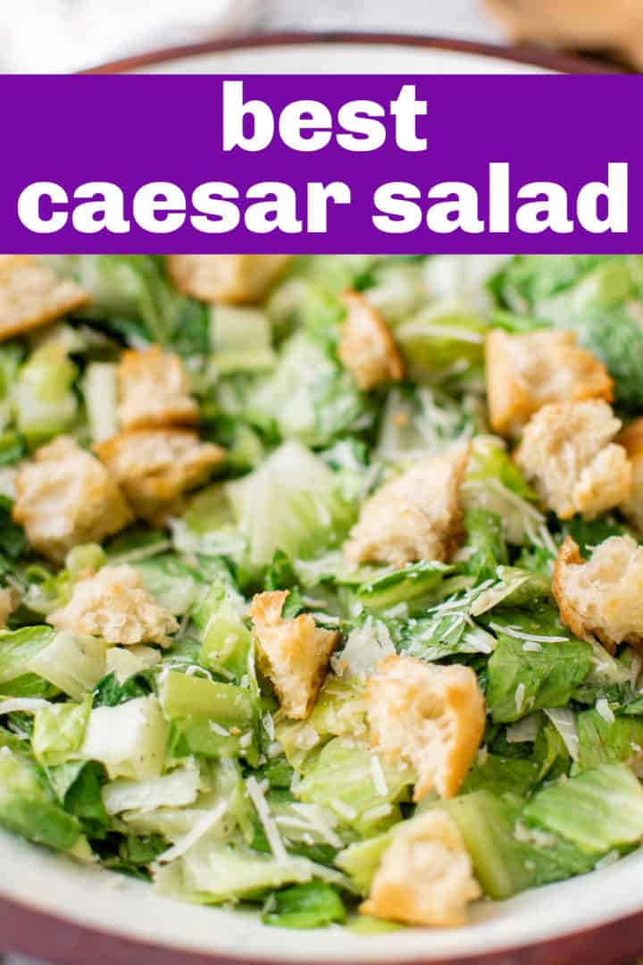 Close up view of a caesar salad with croutons and homemade dressing.