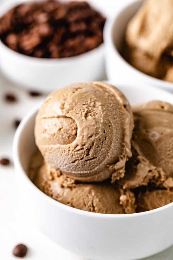 Scoops of homemade coffee ice cream in a white bowl.