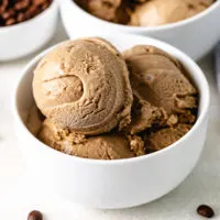 Small white bowl filled with coffee ice cream.