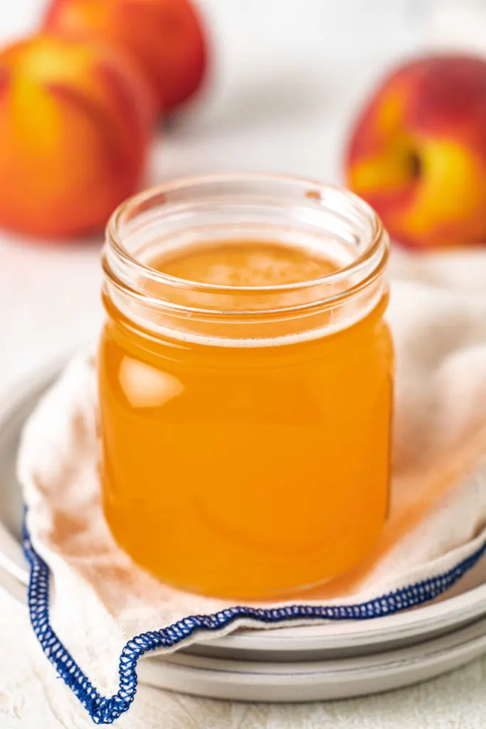 Side view of simple syrup in a jar.